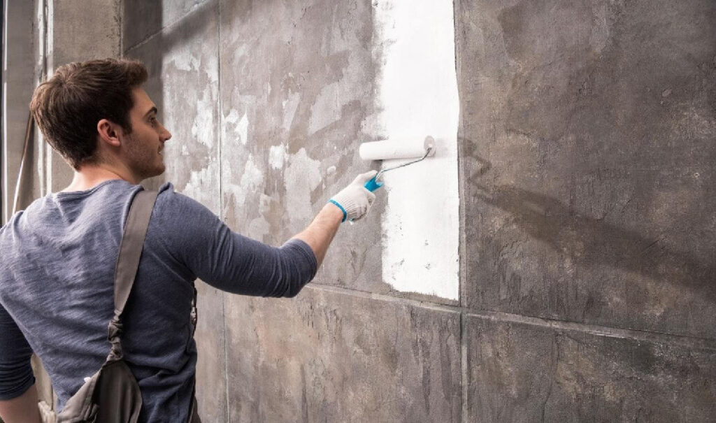 man painting wall